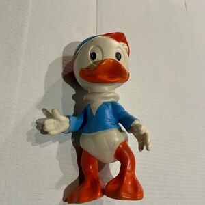 Vintage Walt Disney’s nephew Huey character w orange blue and off white plastic